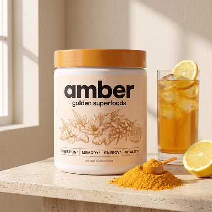 Amber Golden Superfoods tub with a glass of the iced golden drink, powder and lemon